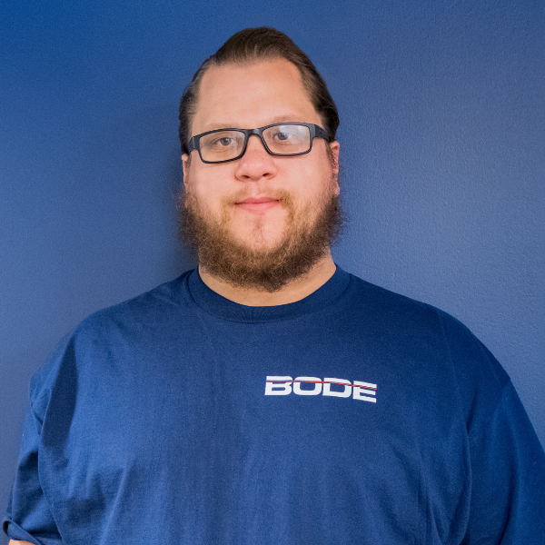 Nick Scarlett Headshot Blue Wall