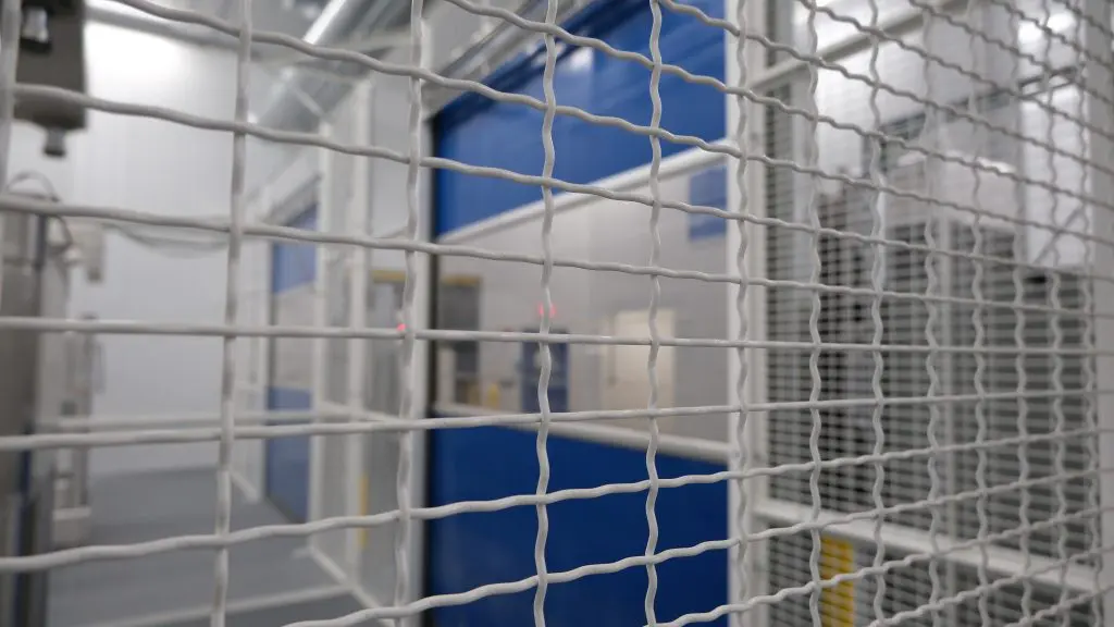 wire caging around machine in a warehouse