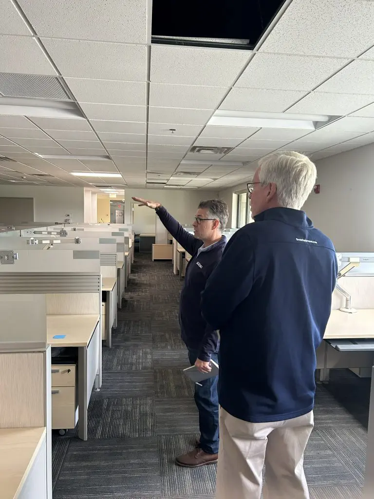 Scott and Don analyzing empty office space