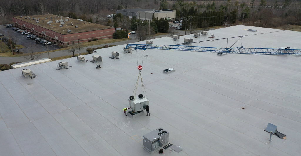 crane dropping hvac on roof