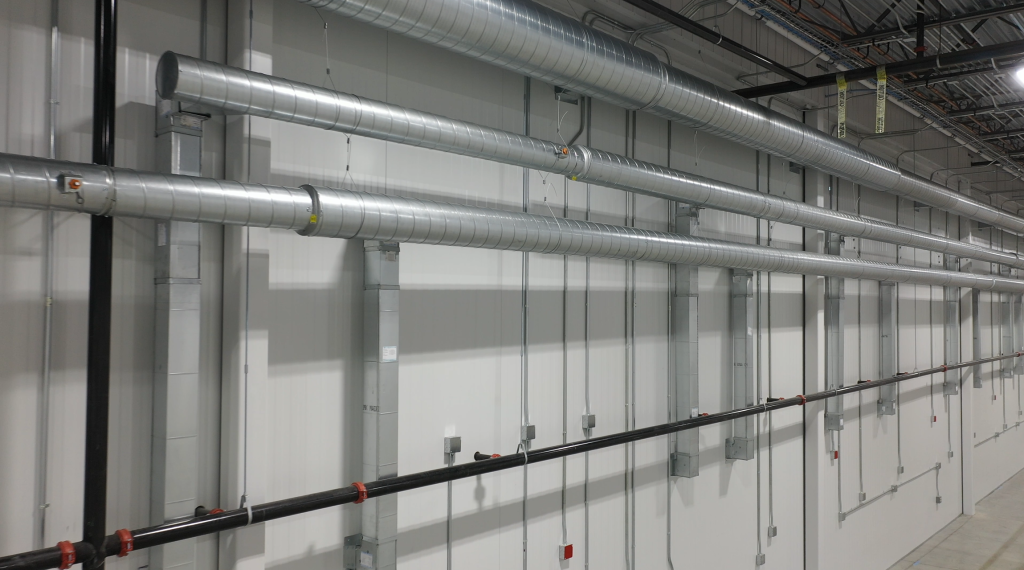 hvac and electrical on wall in warehouse