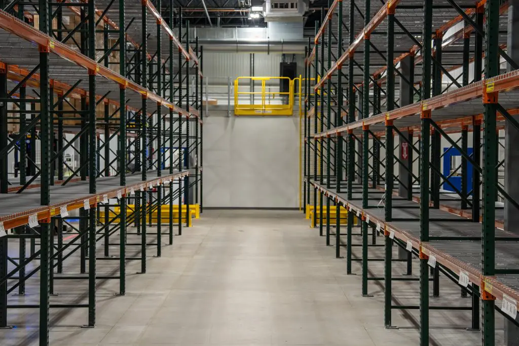 warehouse aisle with racking and safety gate