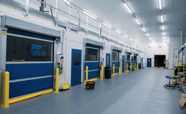 Interior of manufacturing facility with blue high speed doors